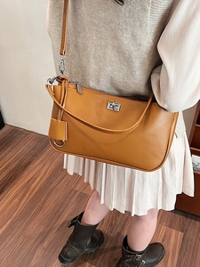 Retro caramel brown PU leather crossbody bag with silver twist lock and shoulder strap
