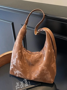 Brown marble pattern hobo bag with adjustable wide strap and polished gold hardware