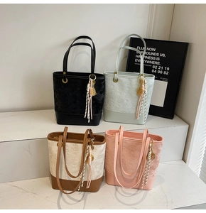 Detail of four colorful textured bucket bags with star patterns and tennis racket charms