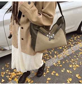 Macro shot of retro tote bag with dual-tone khaki suede and dark olive leather textures