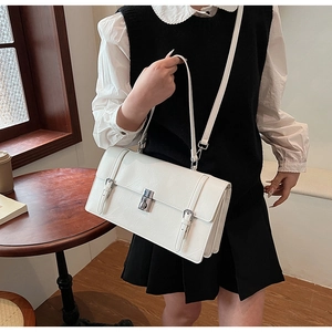 Polished white leather rectangular crossbody bag with silver buckle and flap detail