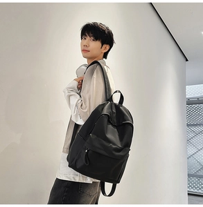 Detail of black waterproof nylon backpack with spacious main compartment and side pockets