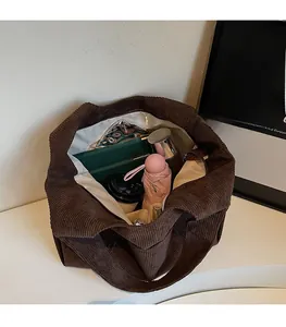 Top view of spacious brown corduroy tote bag interior showing large capacity for essentials