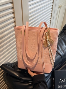 Retro pale pink underarm bucket bag with star embossing and decorative charms