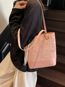 Pink underarm bucket bag with star and bear embossed patterns for daily commute