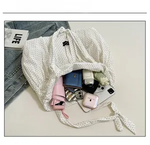 Large capacity canvas tote bag interior showing phone, umbrella and daily essentials