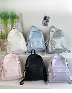 Multi-color casual nylon backpacks display with astronaut pendants in six stylish colors