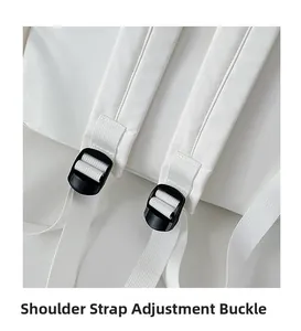 Detail of adjustable black shoulder strap buckle on white minimalist backpack