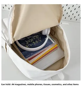 Interior view showing the large capacity for laptops and A4 magazines in this white backpack