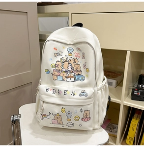 Close-up of cute cream canvas backpack with colorful Capybara cartoon illustrations