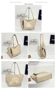 Detalle del bolso tote beige mostrando la textura de cuero suave y borla trenzada