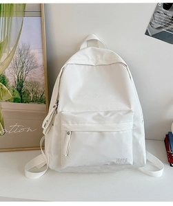 Minimalist white nylon student backpack with Heeg embroidery in a clean lifestyle setting