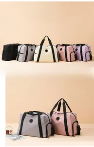 Detail of multi-color waterproof travel bags featuring reinforced handles and side pockets