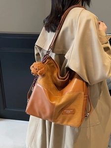 Retro patchwork college style tote bag in brown leather with a cute teddy bear charm