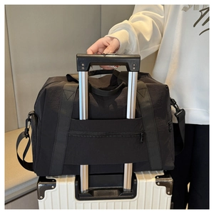 Detail of black oxford travel bag with luggage sleeve attachment for fitness and sport