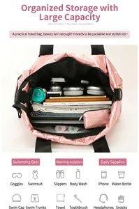 Top view of pink fitness travel bag showing spacious interior with organized compartments