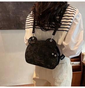 Detail of bear-shaped shoulder bag in black PU leather with Princess text embroidery