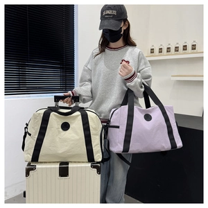 Detail of large travel bags with sturdy handles and adjustable shoulder straps