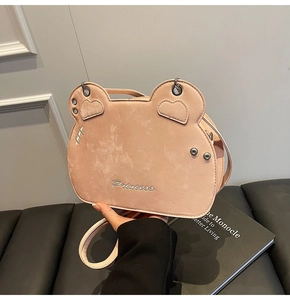Detail of light pink princess backpack with animal ears and delicate embroidery