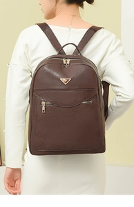 Deep brown faux leather backpack with litchi texture and gold-toned metal logo detail