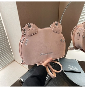 Detail of pink cat-ear crossbody bag with Princess embroidery and fine shoulder strap