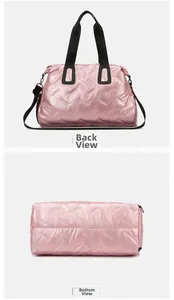 Pink quilted fitness bag detail showing the back luggage sleeve and wide bottom view