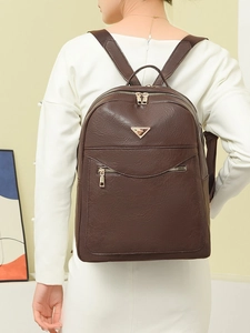 Deep brown pebble leather backpack for women with metal logo for daily travel