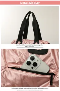Pink quilted fitness bag detail with wide handles and rear zipper pocket for phone