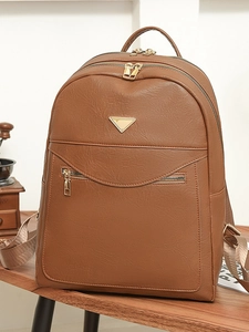 Vintage brown leather backpack with multiple zippers and large capacity for travel