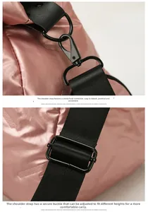 Detail of adjustable black shoulder strap with sturdy metal hook on pink fitness bag