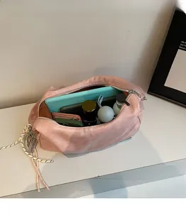 Pink faux leather tote bag interior showing large capacity for umbrella and notebook