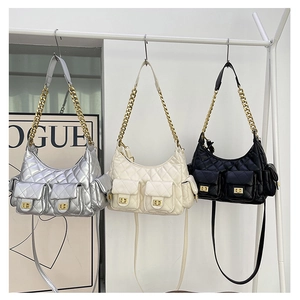 Three quilted chain shoulder bags in silver, beige, and black with double front pockets