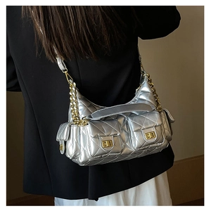 Silver quilted shoulder bag with gold chain strap and dual front flap pockets