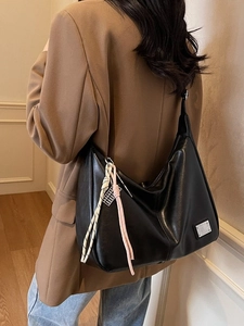 Vintage black large capacity shoulder bag for women with woven knot charm on shoulder