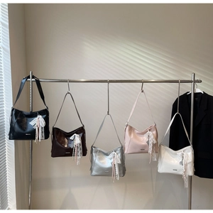 Variety of glossy minimalist bucket bags in five colors with lace tassel charms