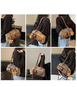 Detail shots showing retro Boston bag with double front flap pockets and bear charm accessory