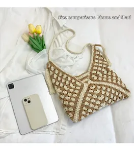 Detail showing capacity of crochet bag compared with a tablet and a smartphone