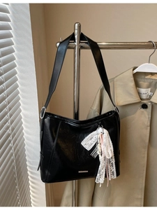 Minimalist black PU leather half-moon bucket bag with lace pendant and silver hardware