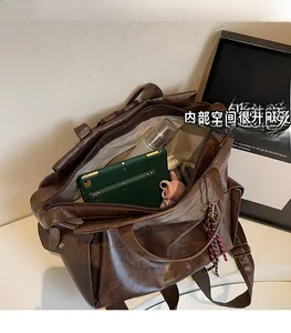 Interior view showing the large capacity of a retro brown faux leather backpack