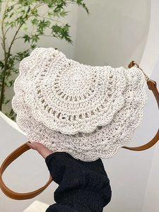 Bohemian crochet crossbody bag in cream white with woven patterns and brown leather strap
