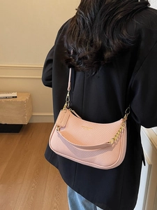Chic pink woven leather shoulder bag with gold chain strap for women, crossbody style