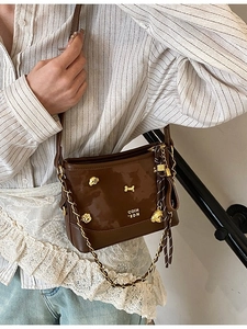 Women Fashion PU Leather Crossbody Bag Small Glossy Bucket Bag With Chain Strap And Cute Dog Bone Charm For Daily Casual Commuting