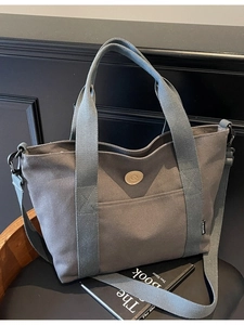 Retro charcoal canvas tote bag with adjustable shoulder strap and leather G logo patch