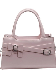 Pink faux leather handbag for women featuring decorative bow and silver buckles