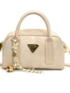 Sac bowling vintage crème avec logo doré et charme de poignée en corde tressée