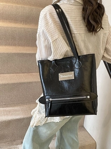 Large black crinkled PU leather tote bag with stylish metal tag for daily commuting