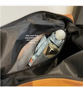 Detail view of large travel bag showing dedicated dry-wet separation waterproof compartment