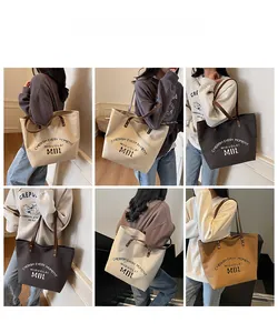 Multiple views of canvas tote bag with leather straps on models in various stylish outfits