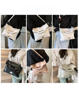 Multiple views of large glossy bucket bag in white, black, pink and silver grey