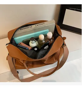 Spacious brown tote bag interior showing capacity for laptop and daily essentials